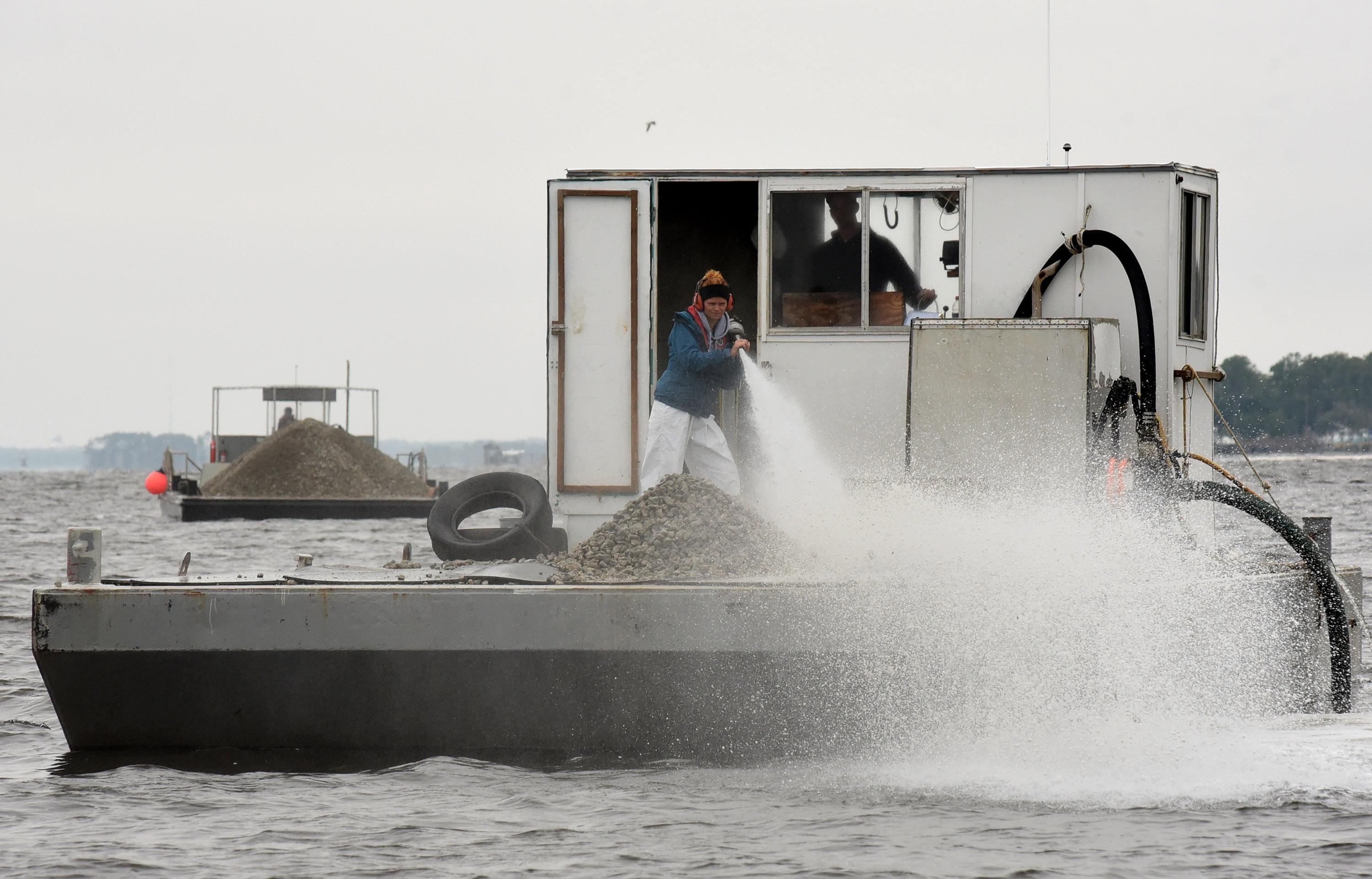 barge brings oyster recovery partnership shells out to be planted into a reef
