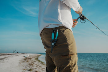 a man has an elite plier attached to his beltloop