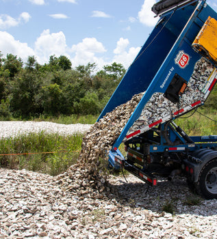 BIG TRUCK DUMPING OYSTER SHELLS FROM GALVESTON BAY FOUNDATION